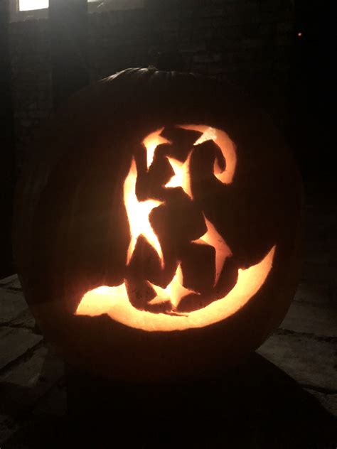 Pumpkin carved in the shape of a witch with a hat